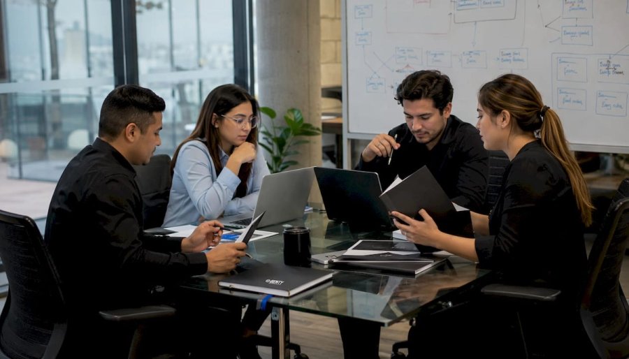 Recruiters reviewing screening workflow