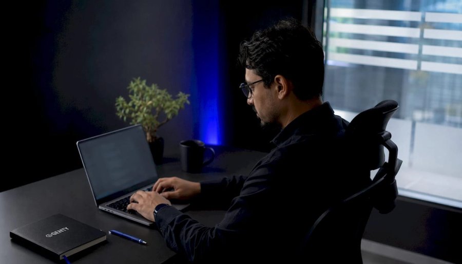 Engineer designing technical screen at home desk