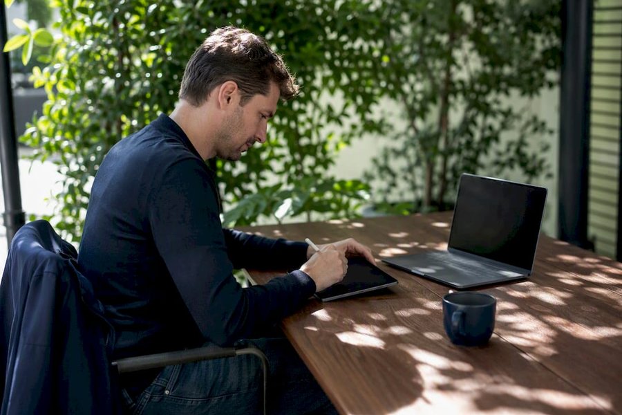 QA engineer designing test cases on tablet