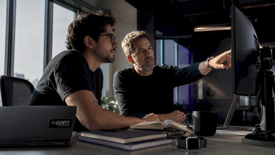 Developer shadowing senior engineer at office