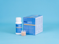PKU EASY Microtabs Plus bottle, box and cup with beige microtabs on a blue background