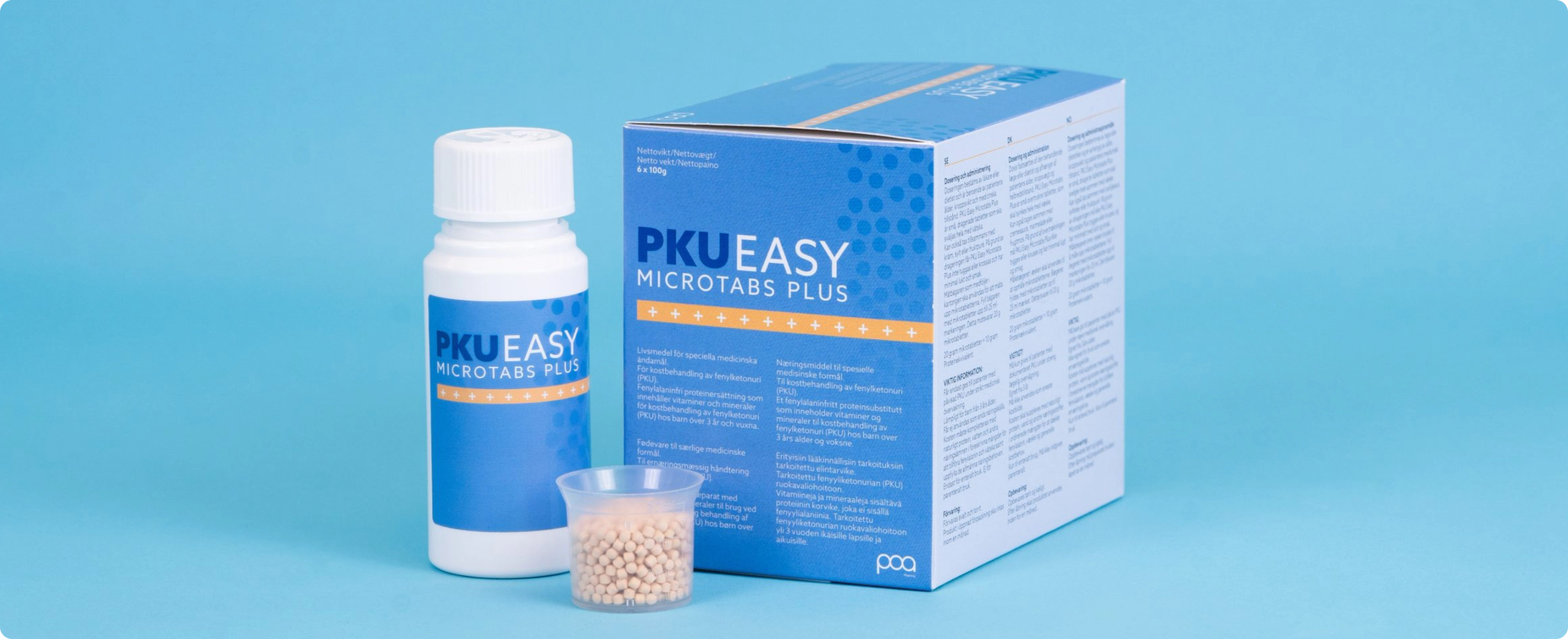 PKU Easy Microtabs Plus bottle and box displayed alongside a small cup of microtablets on a blue background