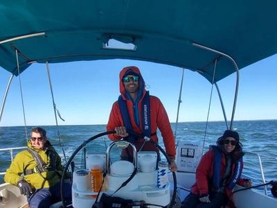 Students learning at the helm