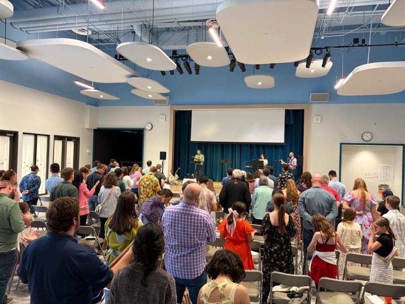 A church meeting in a school cafeteria
