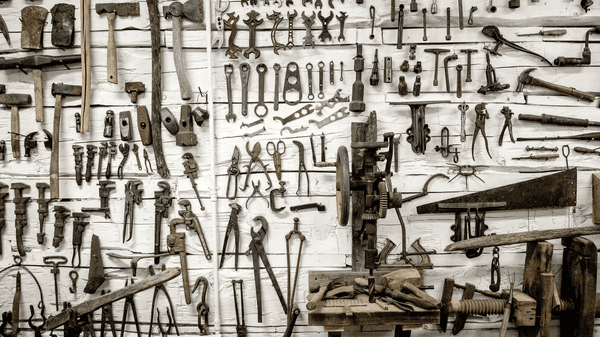 A wall with old-fashioned tools