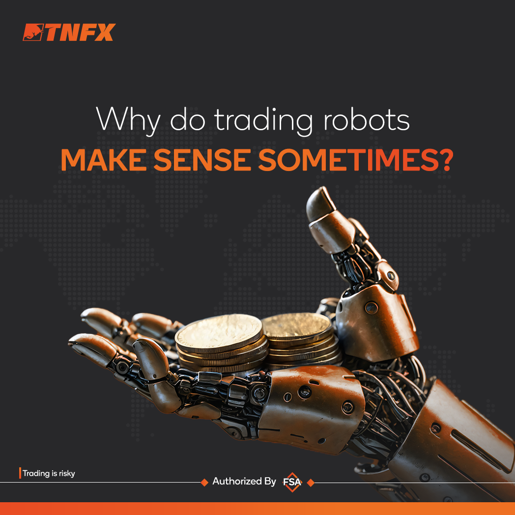 a robot hand holding coins