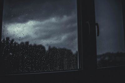 Picture of a window at night with raindrops 