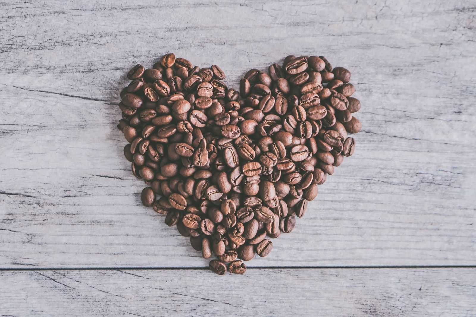 Picture of Coffee beans arranged in shape of heart symbol