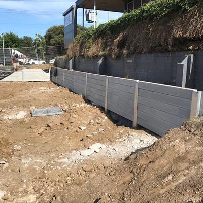 Concrete sleeper retaining wall under construction along a commercial street frontage on La Trobe Terrace, Newtown Geelong