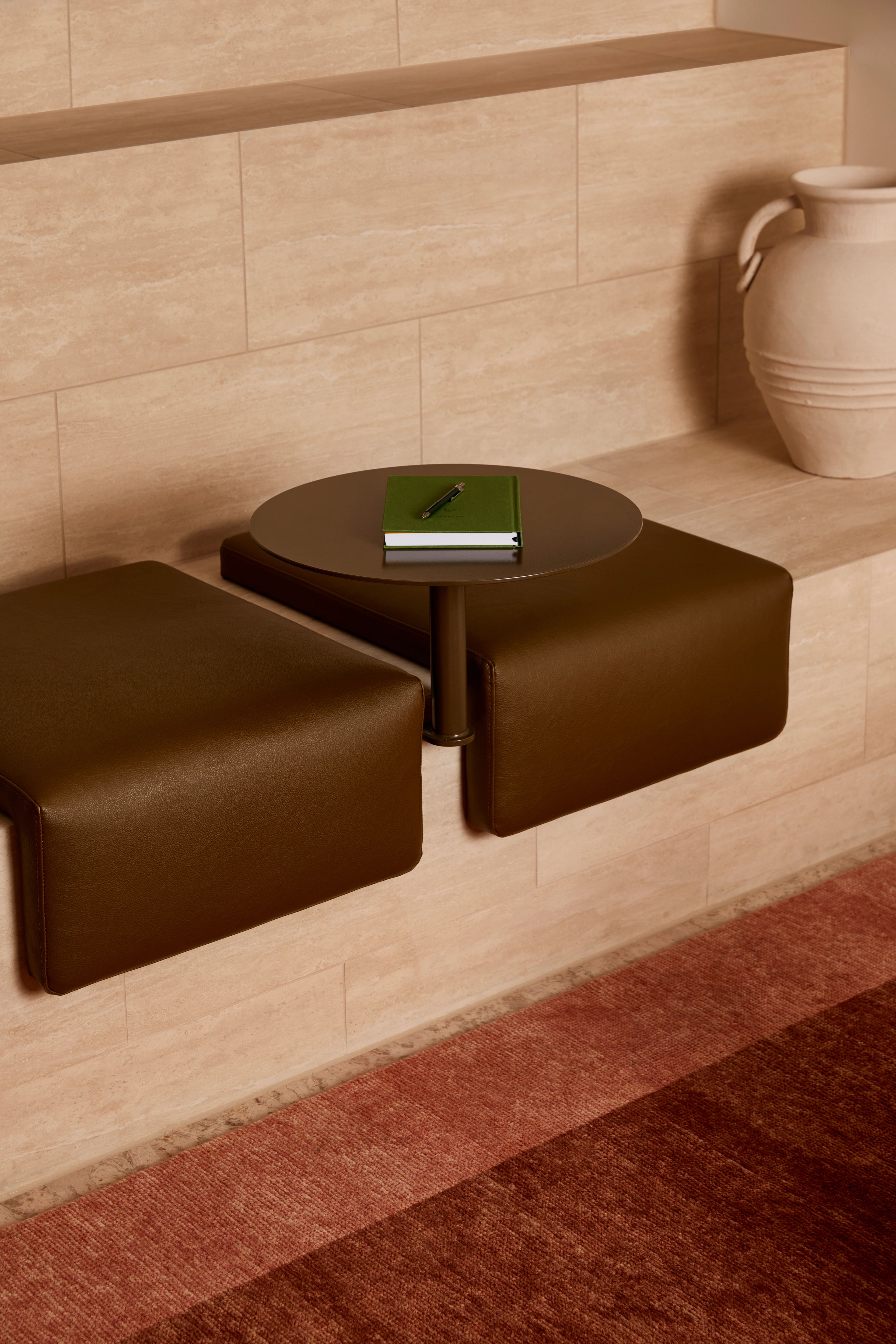 A padded bench seat at Forum Worspace's arrival area designed by Foolscap.