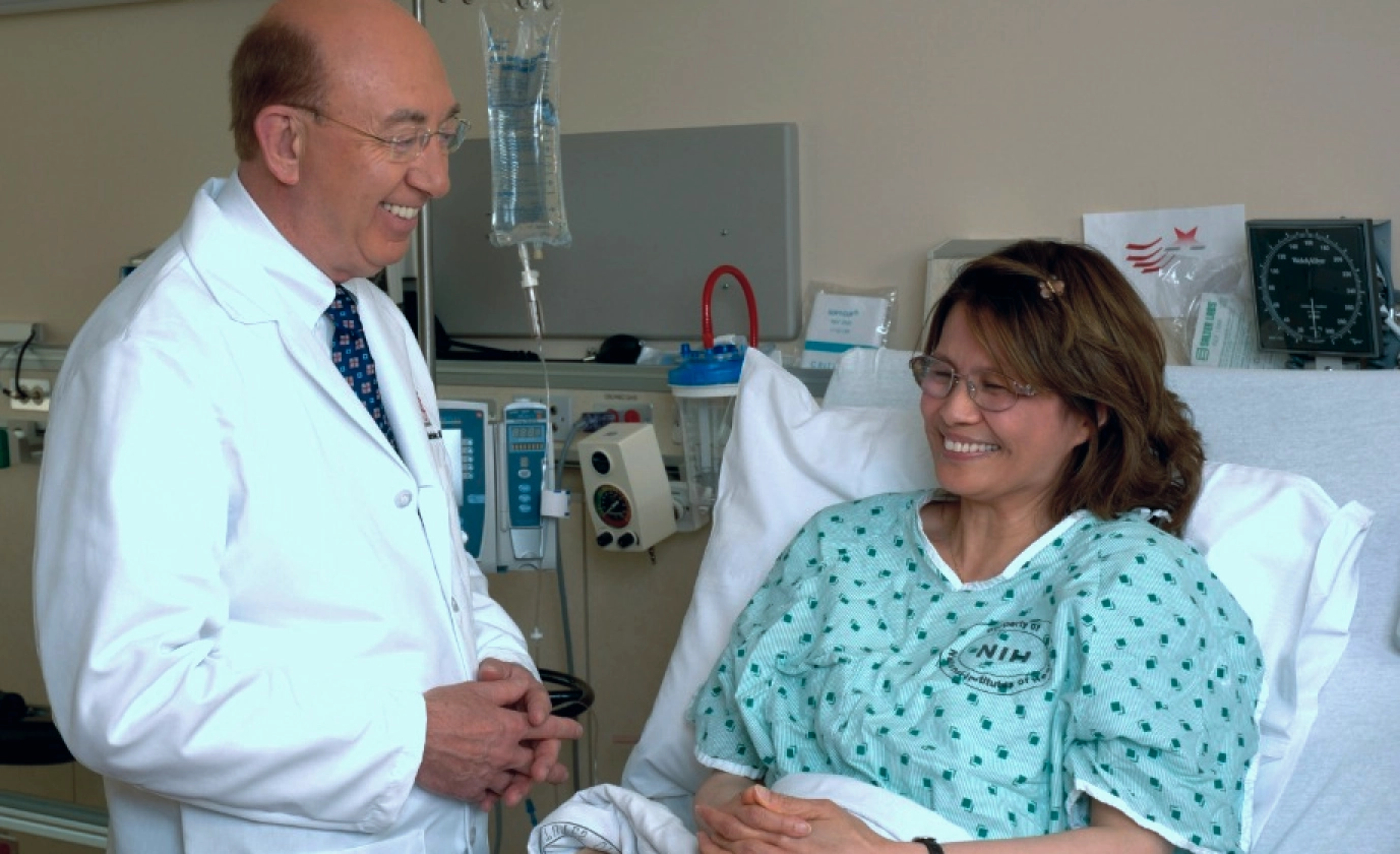 Patient seated comfortably while discussing infusion treatment with doctor
