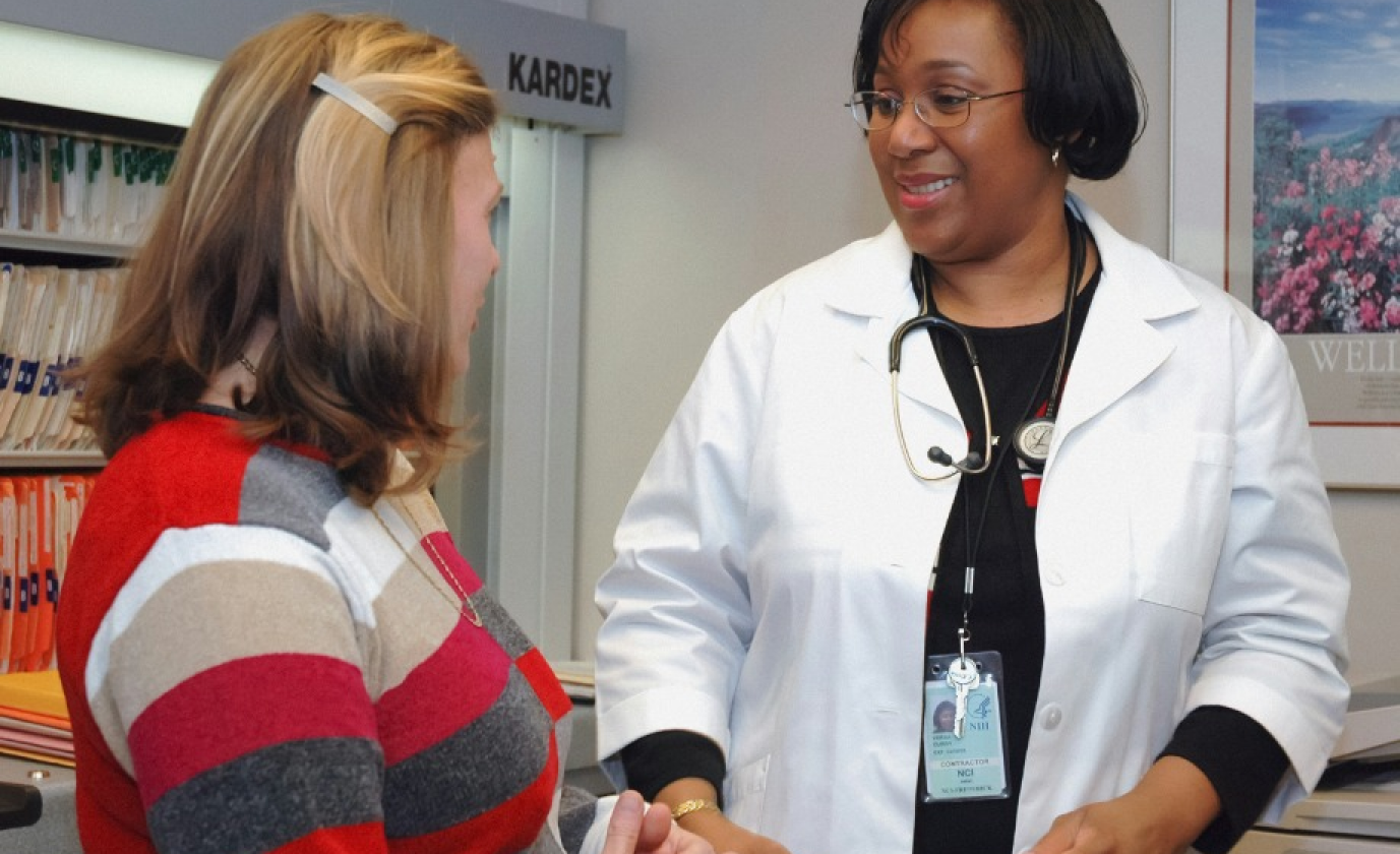 Doctor enthusiastically discussing treatment with patient