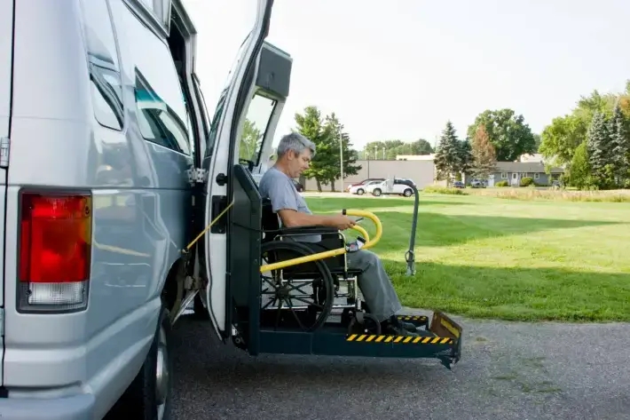 A Patient in a Wheelchair uses our Accessible Van Transportation Services to visit Violet Health Infusion.