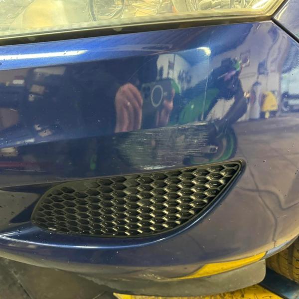 Before — Full Front Bumper Repair on a Vauxhall Zafira in Wigan