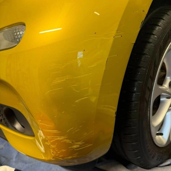 Before — Front bumper corner repair on a SMART Car in Wigan