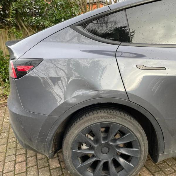 Before — Rear Wing Dent Repair on a Tesla Model Y in Wilmslow, Cheshire