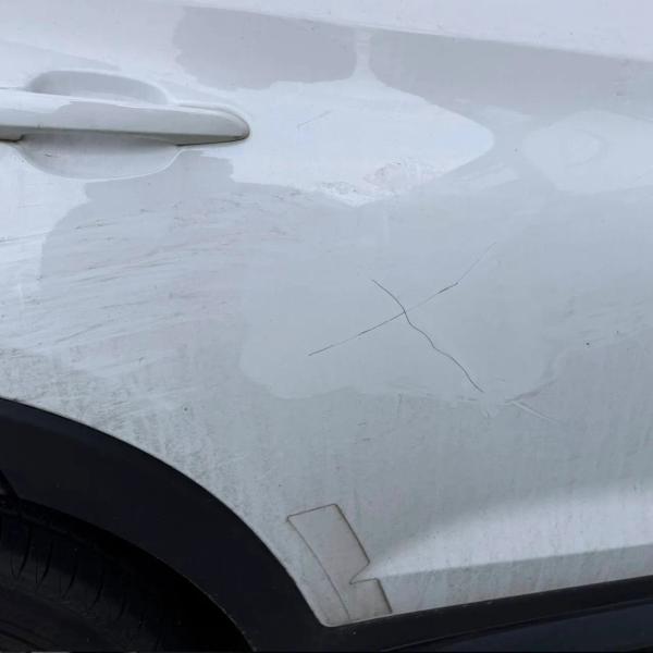 Before — Door Repair on a Hyundai Tucson in Wigan
