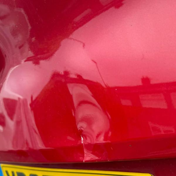 Before — Tailgate Dent and Stone Chip Repair on a Kia Sportage in St Helens, Merseyside