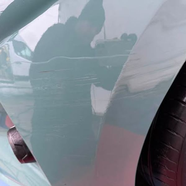 Before — Front bumper corner and wing mirror repair on a Hyundai i10 in Wigan