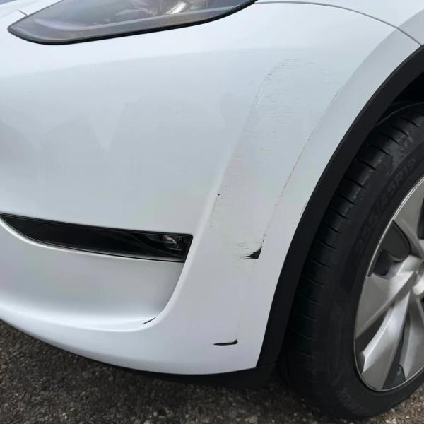 Before — Front Bumper Repair on a Tesla Model Y in Standish, Wigan