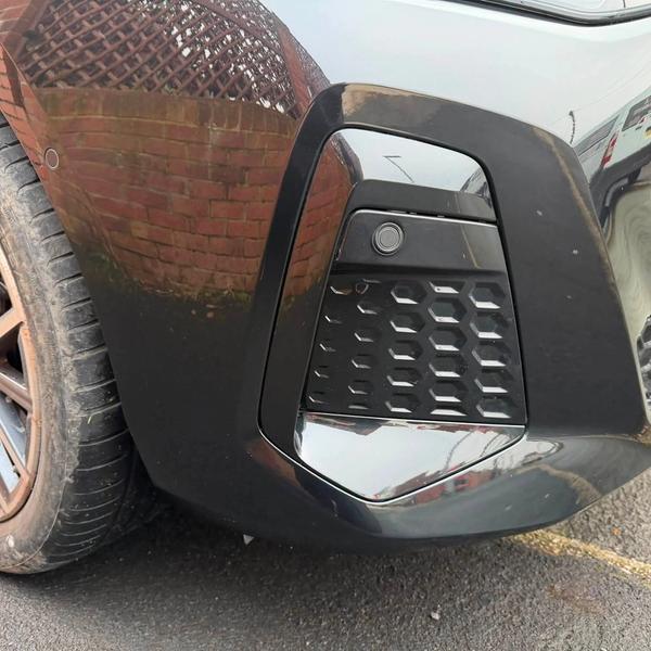 After — Front bumper corner and plastic grille surround repair on a BMW 2 Series in Whelley, Wigan