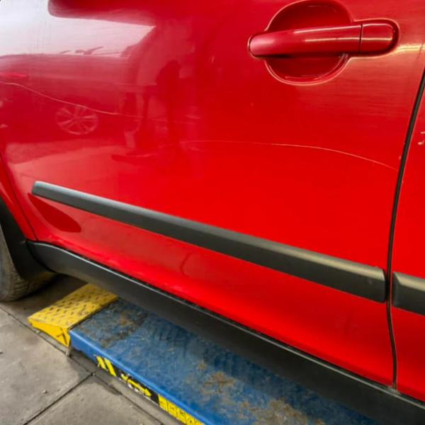 Before — Key Damage Repair Across Passenger Side Panels on a Skoda Yeti in Wigan