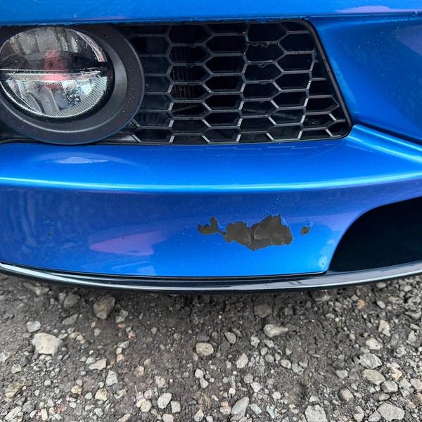 Before — Lower bumper and black splitter repair on a BMW 1 Series in Standish, Wigan