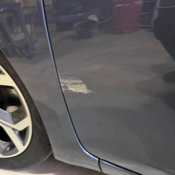 Before — Front Door and Wing Repair on Kia Rio in Bolton