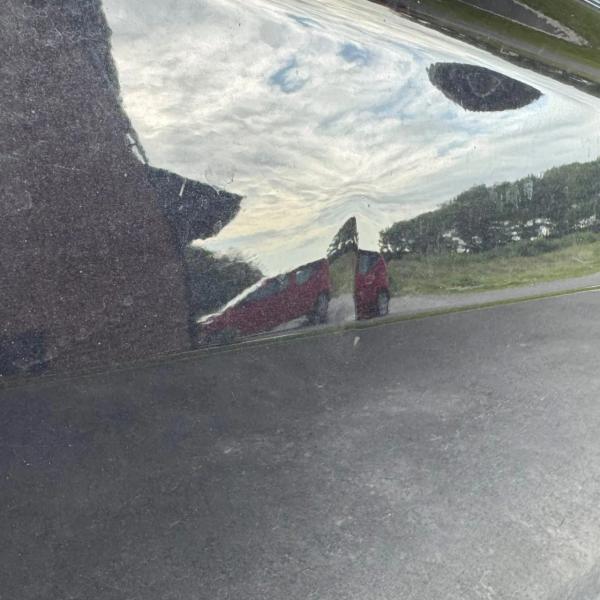 Before — Driver's Door Dent Repair on Volkswagen Tiguan in Southport