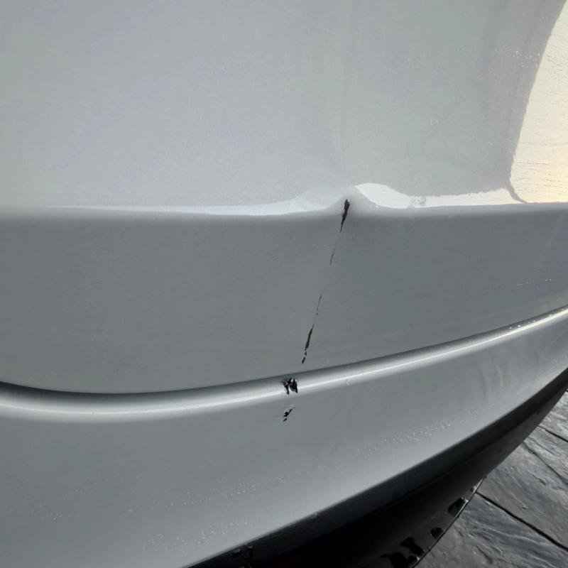 Before - Rear bumper and bootlid dent repair on Tesla Model Y in Hindley, Wigan