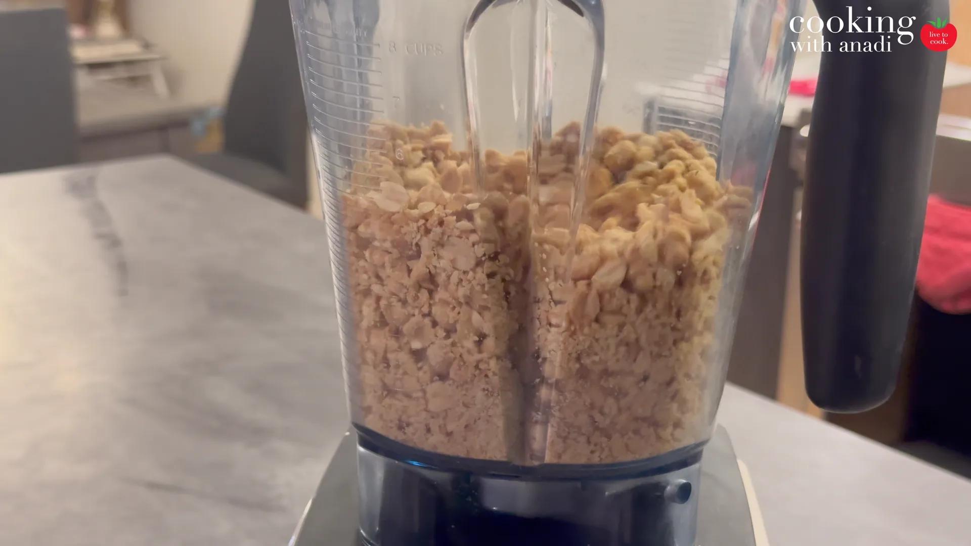 The Vitamix jug packed to the top with raw peanuts