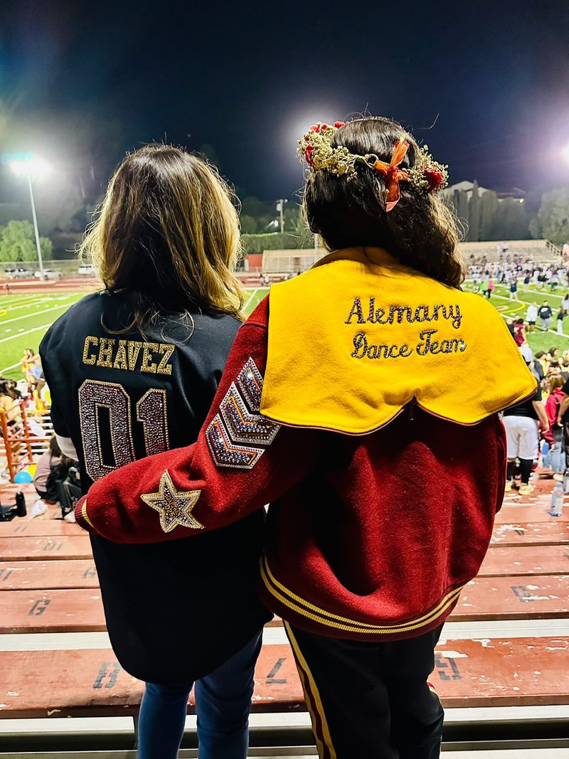 Proud customer showing off a custom blinged jacket