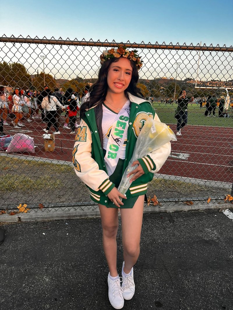 Happy customer in their crystal-blinged letterman jacket
