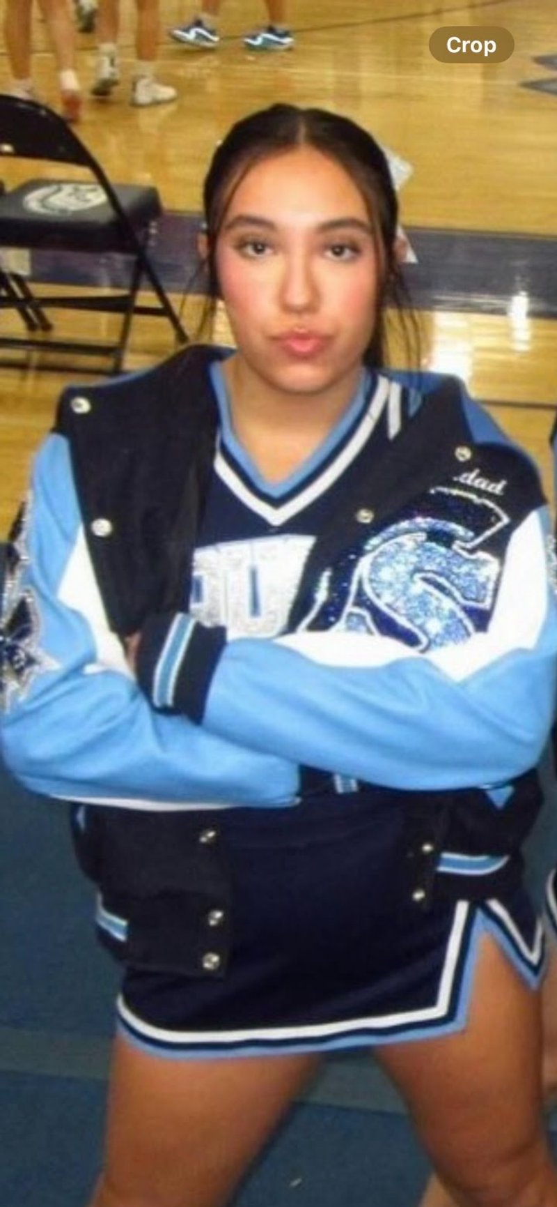Customer in a hand-embellished varsity jacket