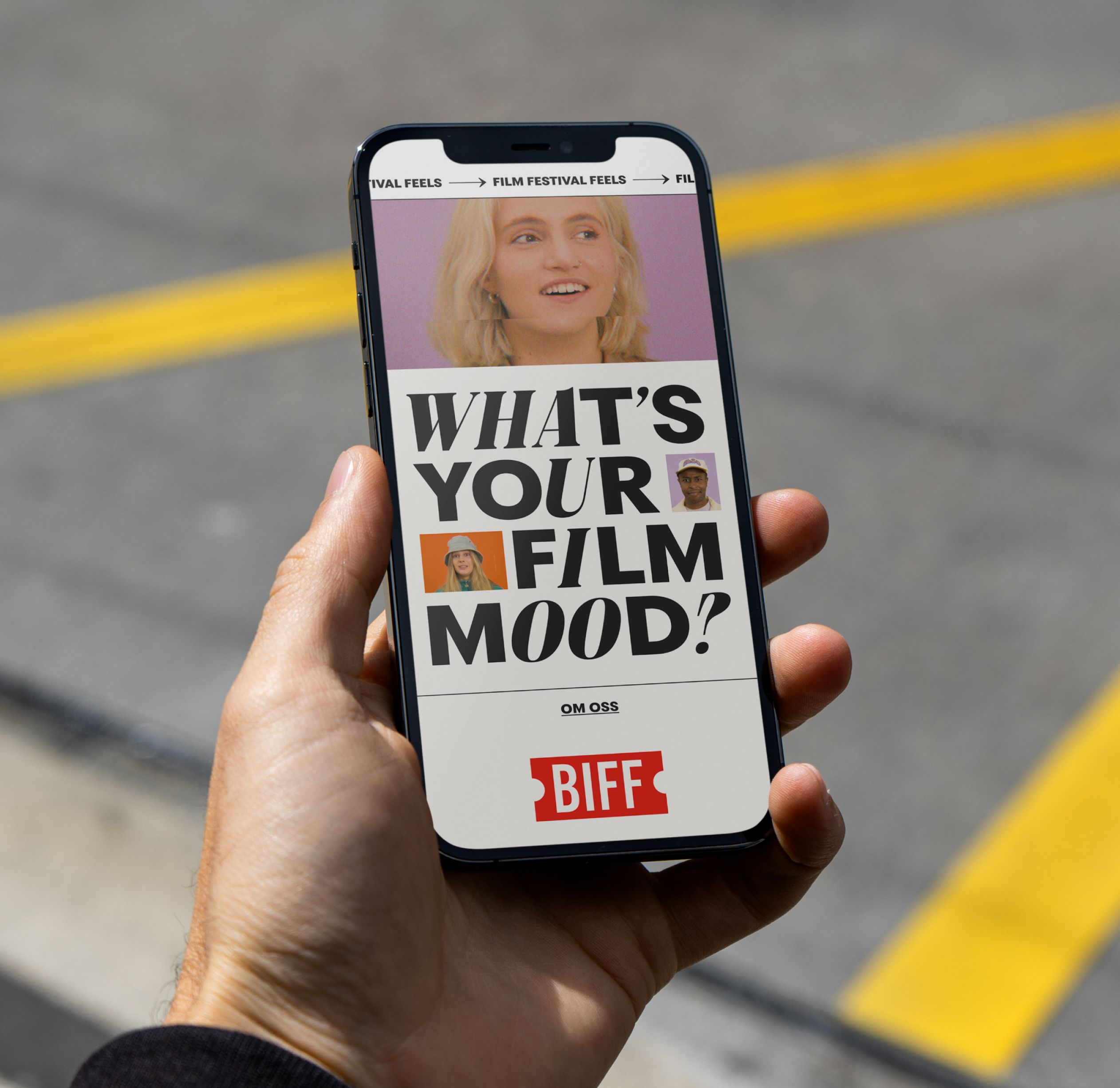 Holding a phone with Film Festival Feels homepage on the screen