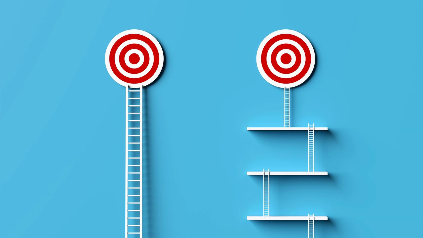 Two red and white targets on a blue background, one reached by a tall single ladder, the other accessed via multiple shorter ladders and platforms. This setup cleverly illustrates different paths to a goal, much like navigating through indirect competitors in a complex market landscape.