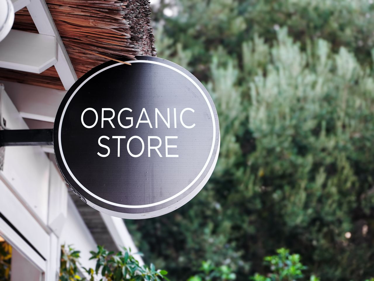 Round organic store sign outside shop