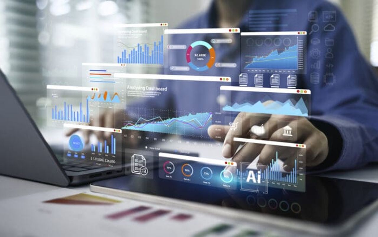 Analyzing dashboard with colorful graphs on computer screen.