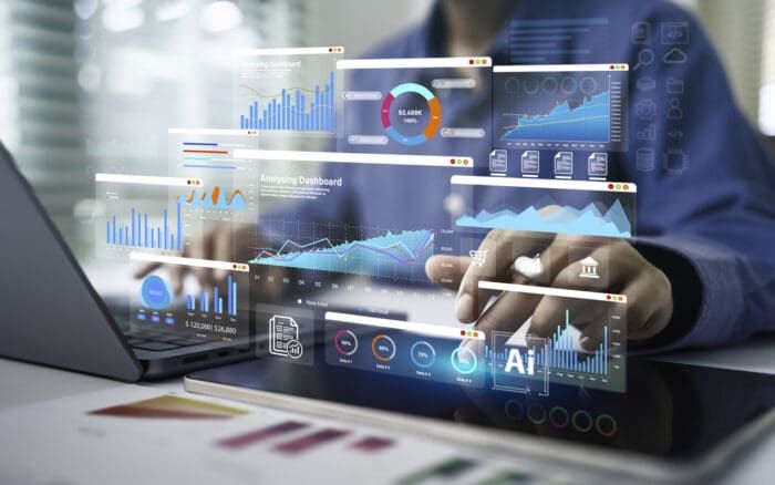 Analyzing dashboard with colorful graphs on computer screen.
