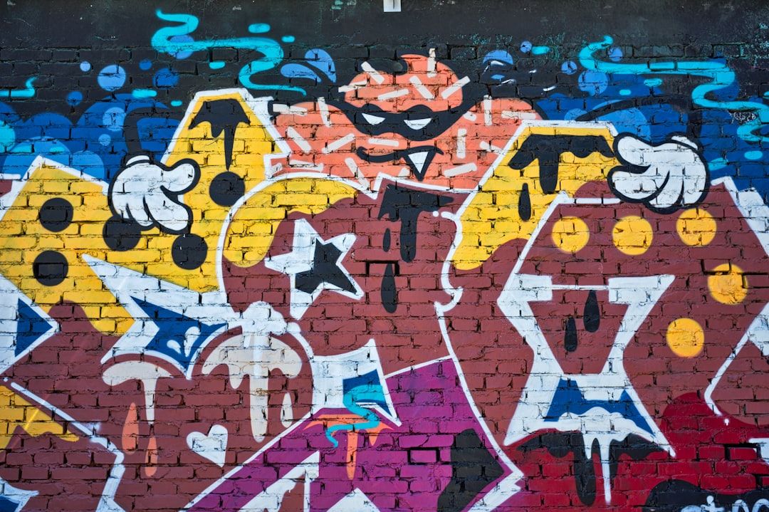 Vibrant street-art graffiti on a brick wall — the guerrilla-marketing aesthetic
