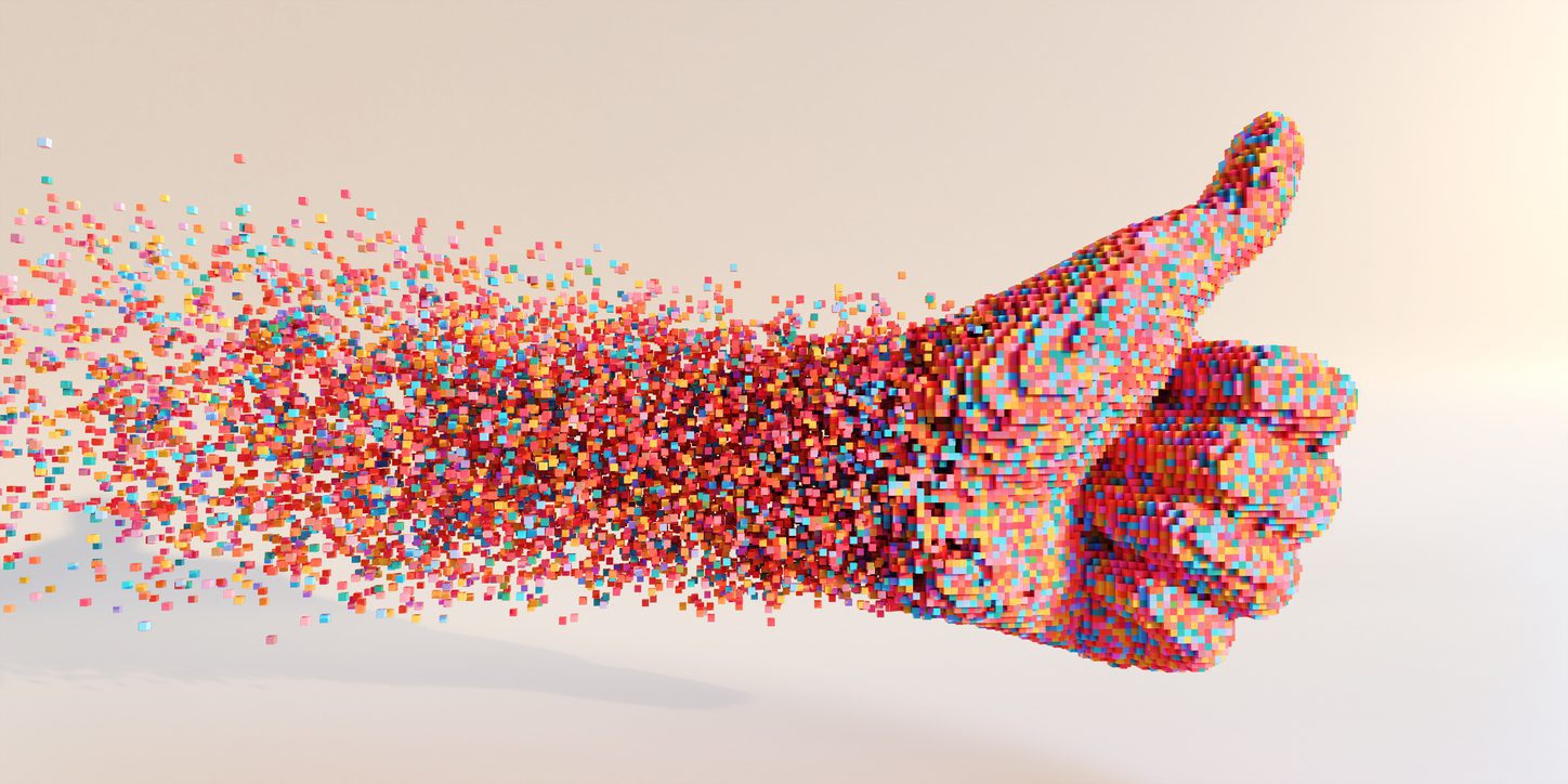 A thumbs-up hand gesture composed of numerous small, colorful cubes disintegrates into the air, creating a dynamic, pixelated effect against a light beige background—a modern take on digital marketing in Madison, Wisconsin.