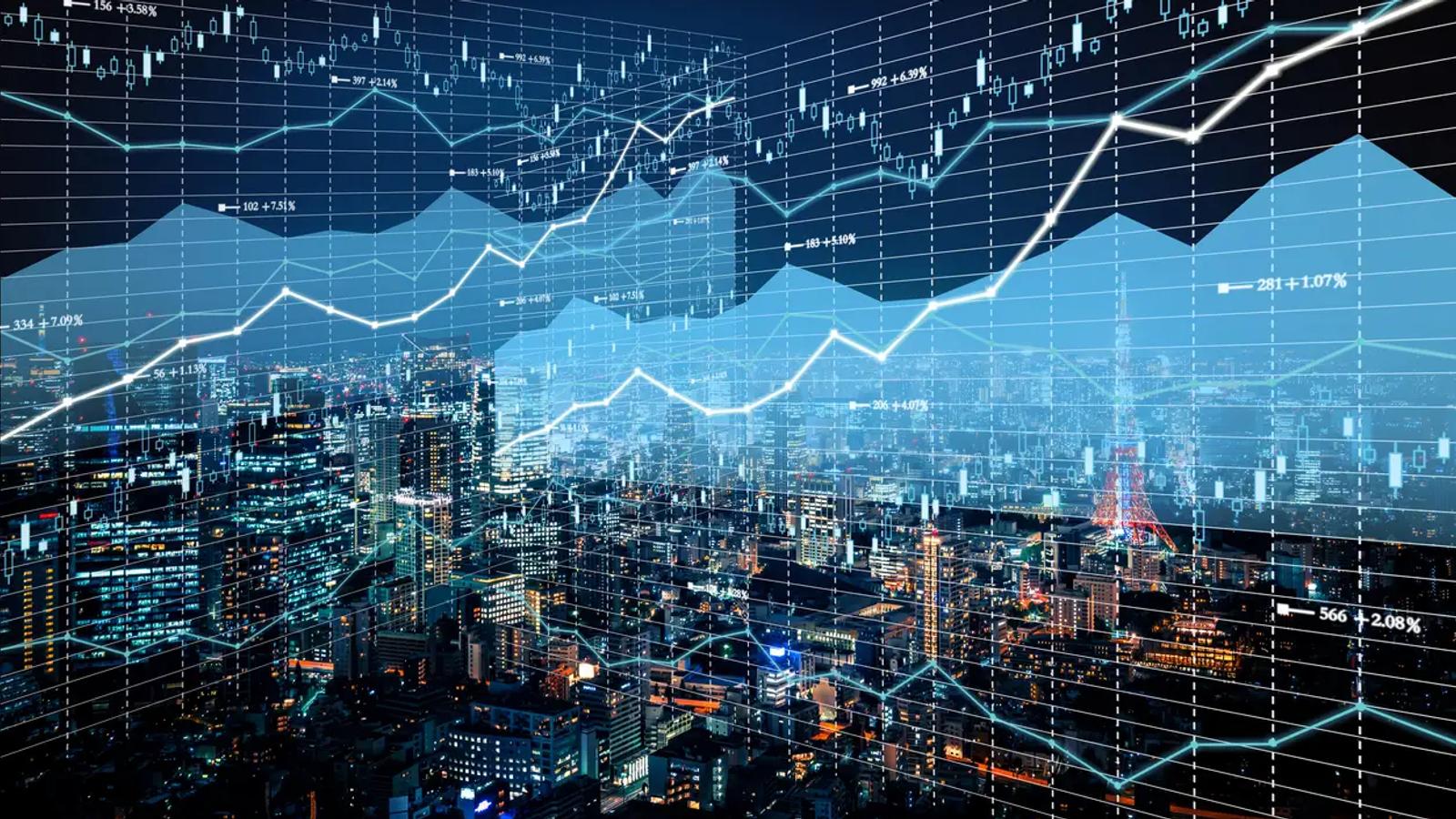 Cityscape with overlay of digital financial graphs