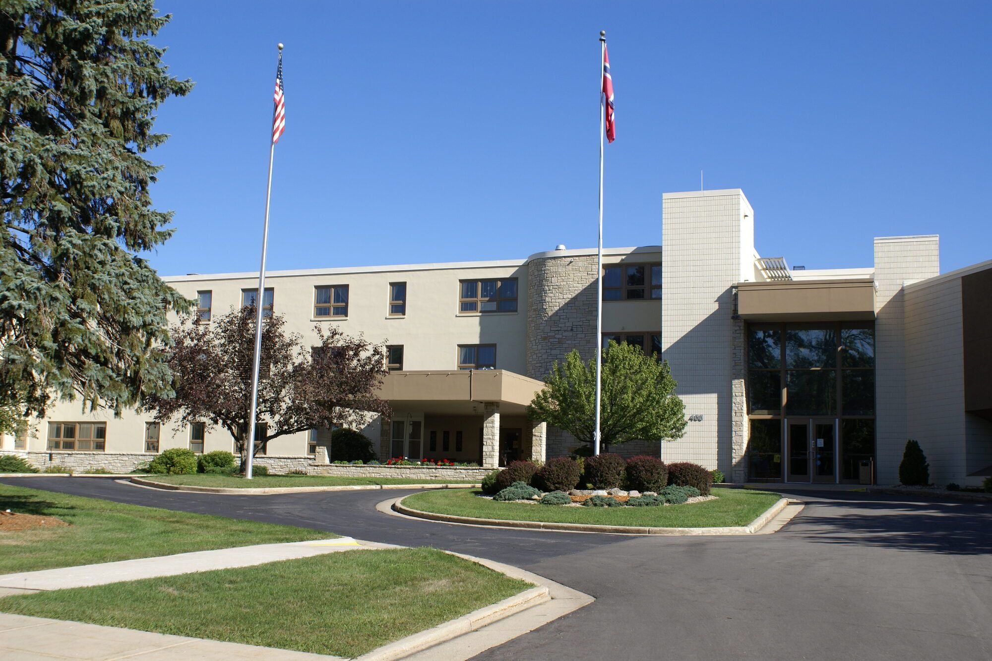 The main entrance and flagpoles at the Skaalen retirement community campus
