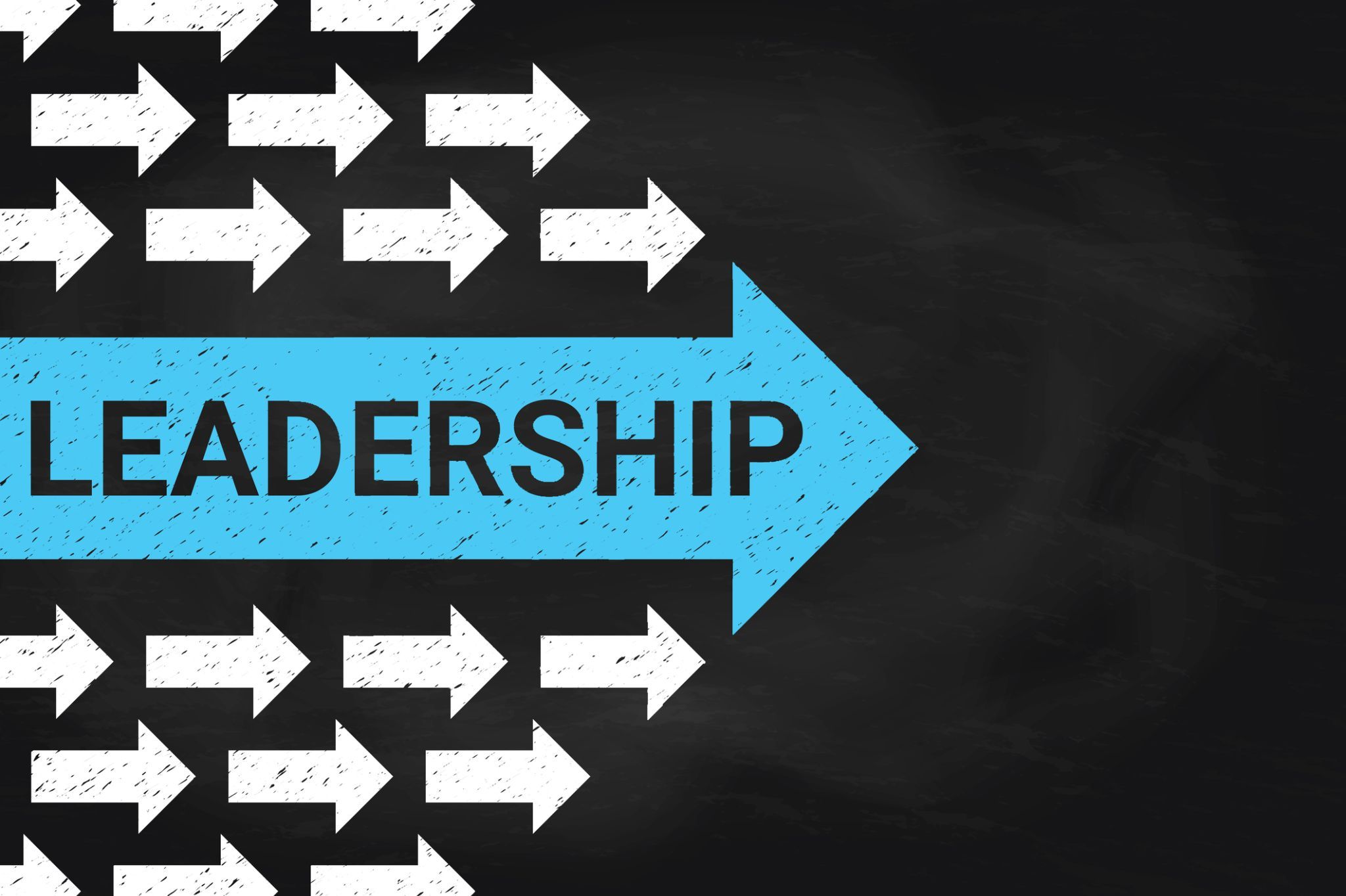Blue leadership arrow among white directional arrows