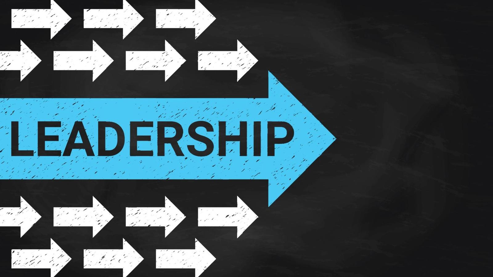 Blue leadership arrow among white directional arrows