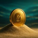 A golden coin resting on a mound of sand