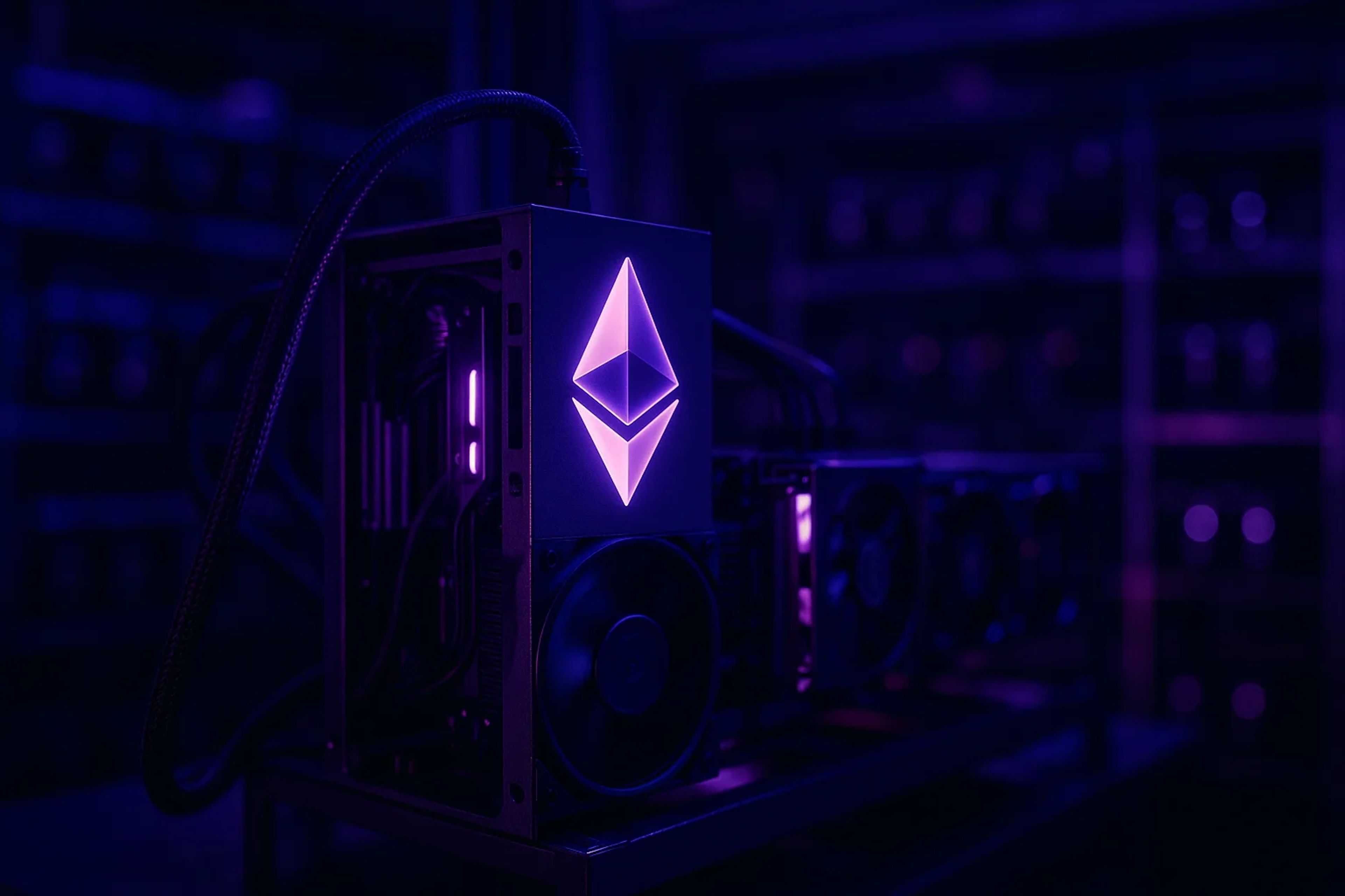 A computer setup with purple lighting and