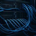 Close-up of server racks with blue cables