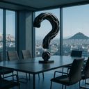 A modern conference room with a large question