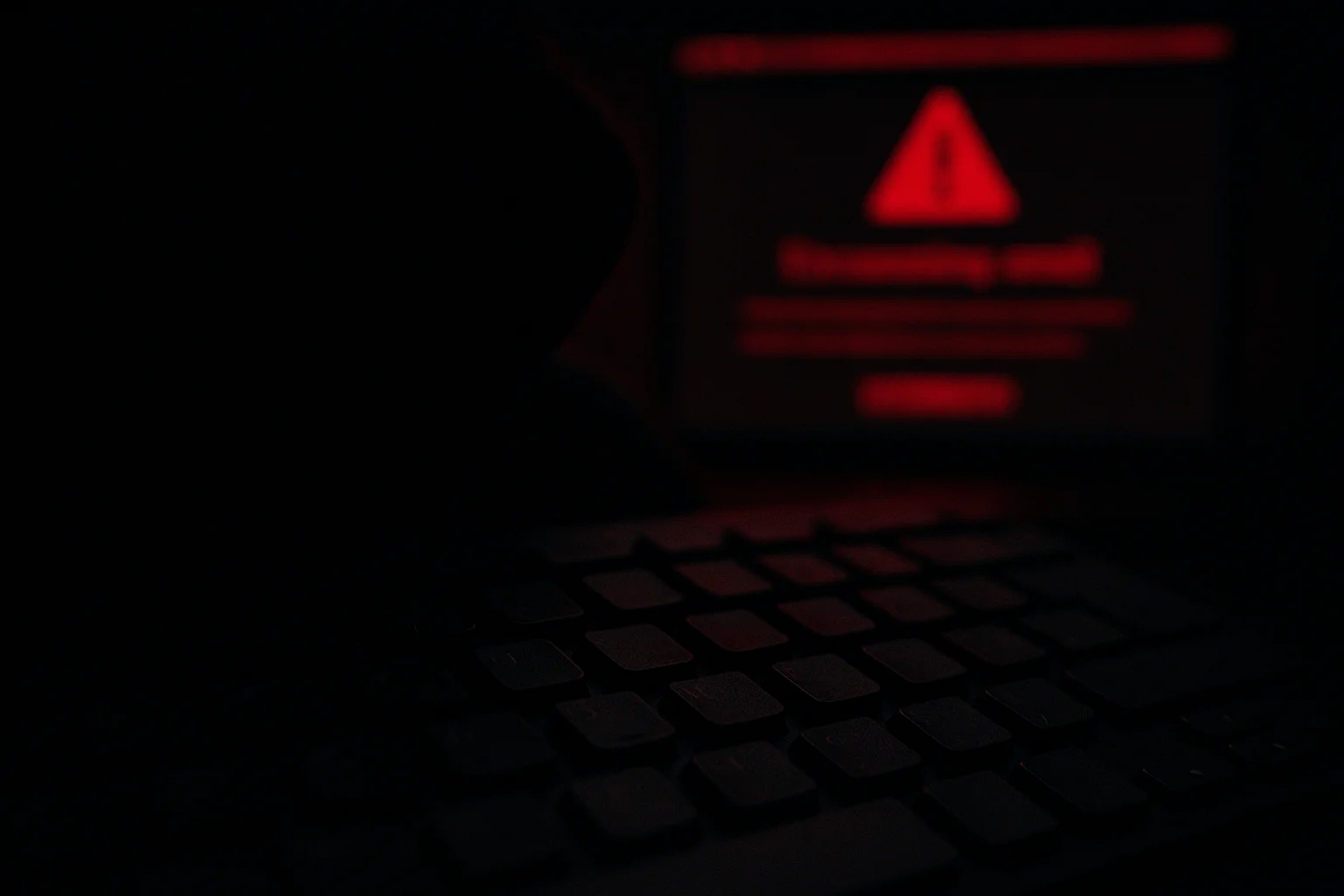 A dimly lit scene featuring a keyboard in the